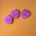 "Mauve scalloped heart corner bookmark with pink trim and the hand-lettered affirmation 'What if it all works out!'"