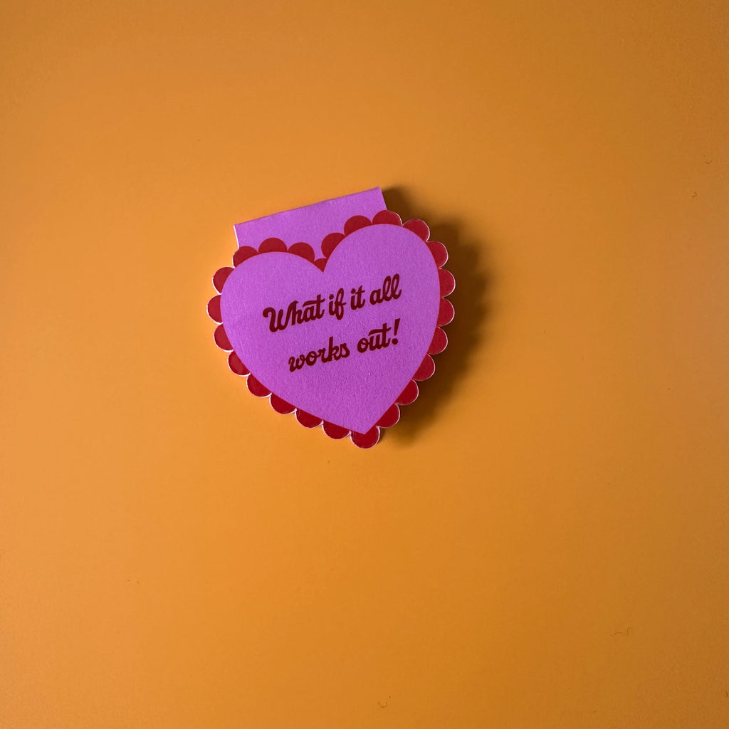"Mauve scalloped heart corner bookmark with pink trim and the hand-lettered affirmation 'What if it all works out!'"