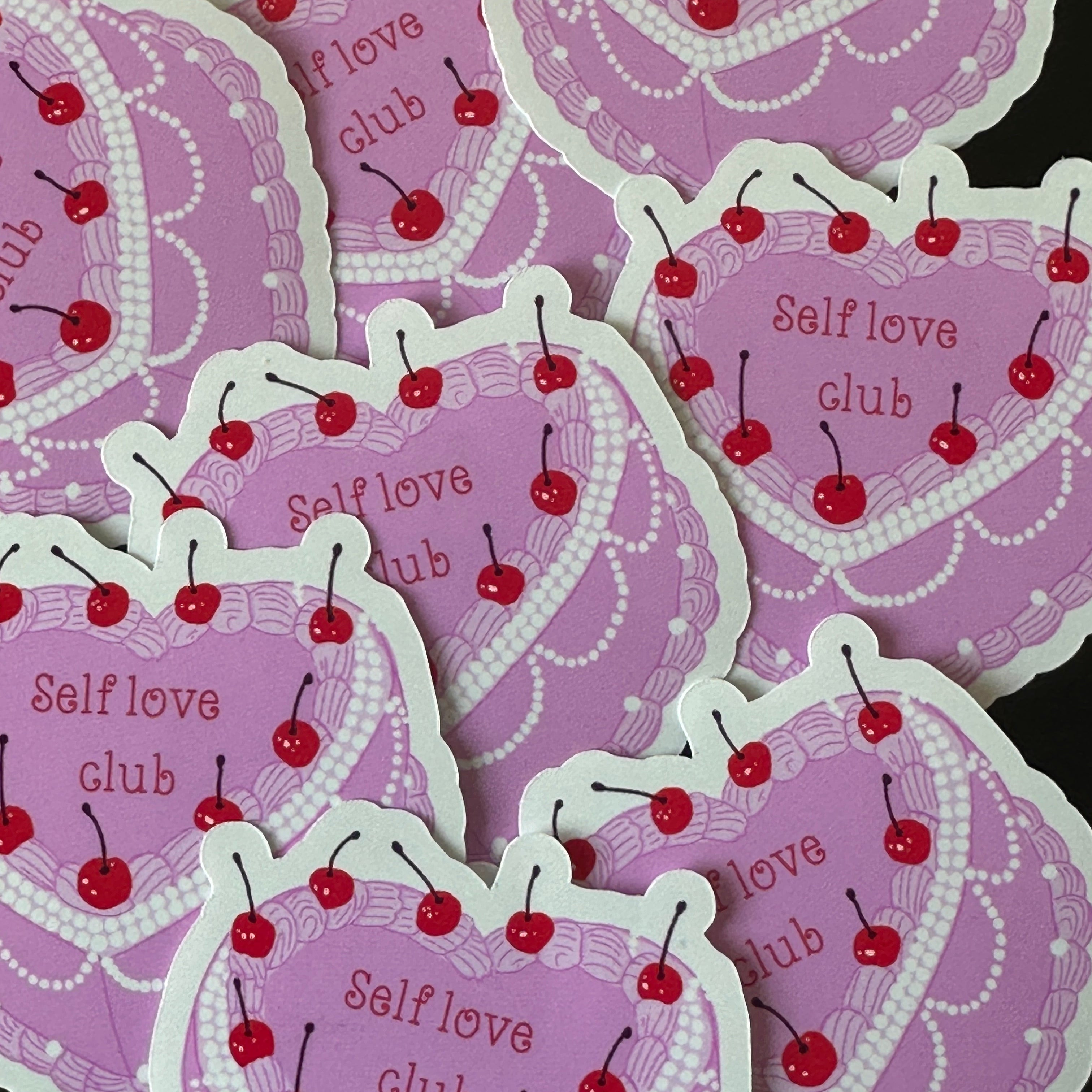 Close-up of the pearl trim and cherry details on the Self Love Club sticker