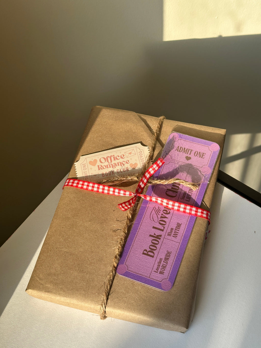 Close-up of the kraft paper wrapping and genre clue tag on a Blind Date with a Book bundle