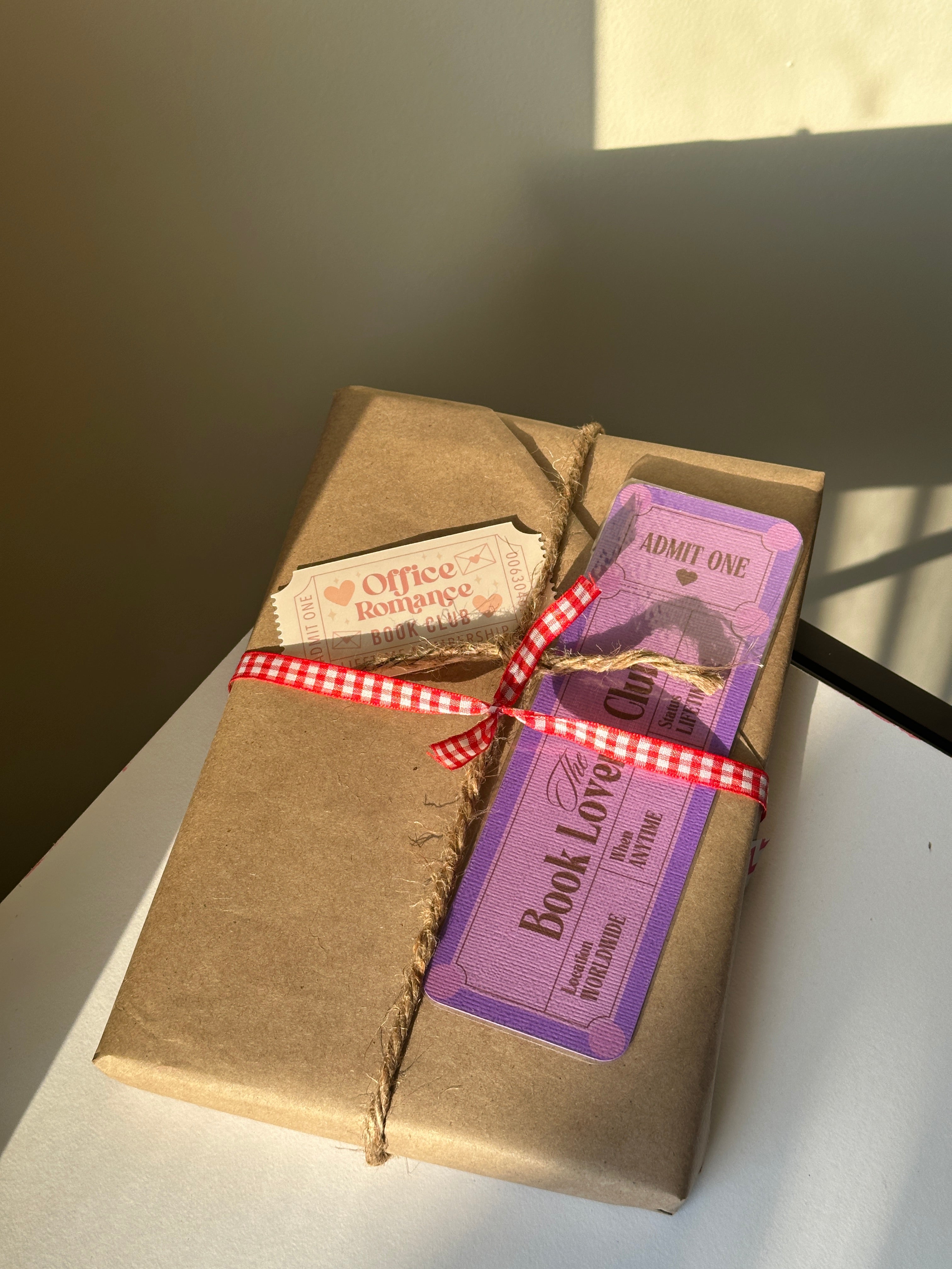Close-up of the kraft paper wrapping and genre clue tag on a Blind Date with a Book bundle